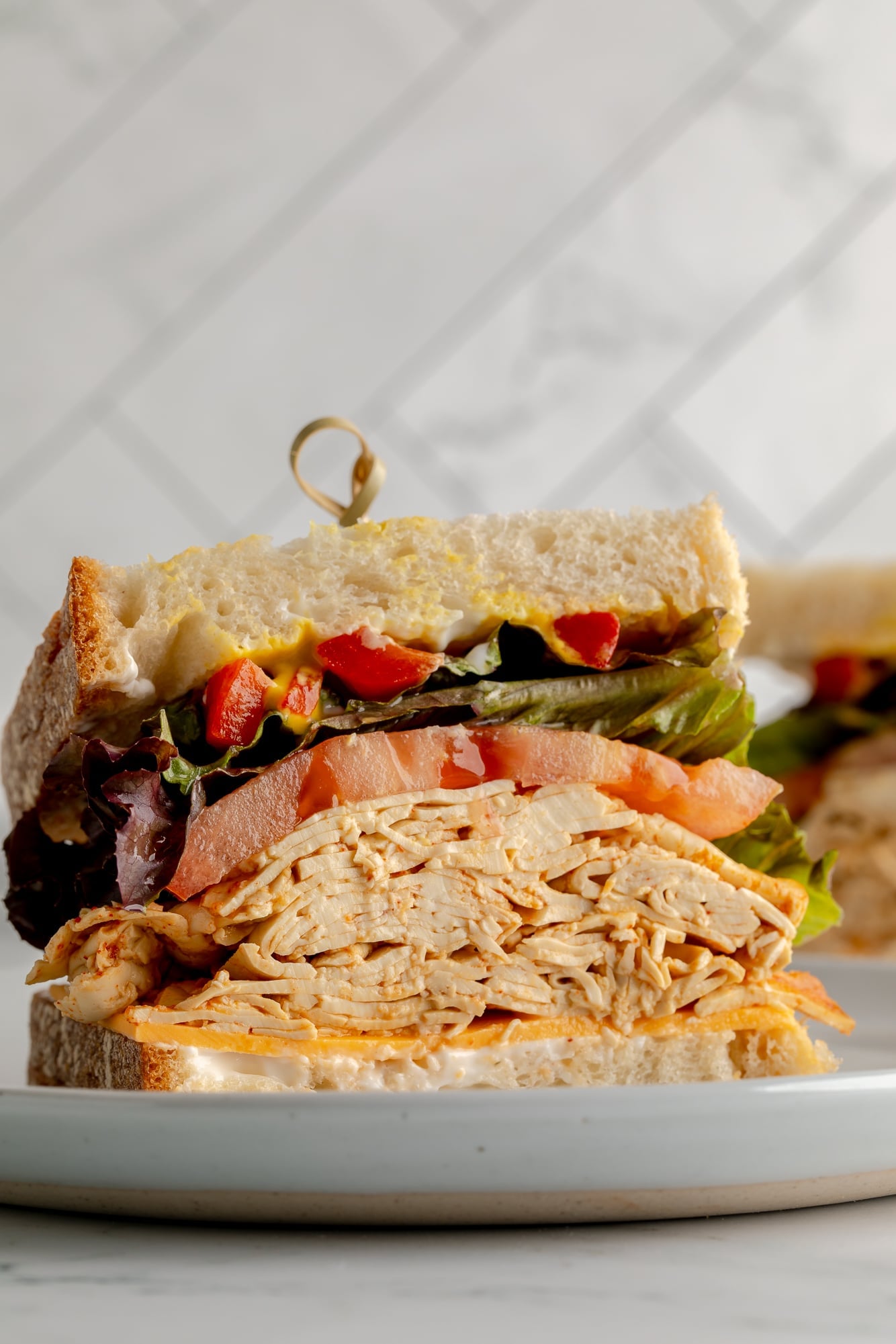 side view of a vegan sandwich made with tofu lunch meat.