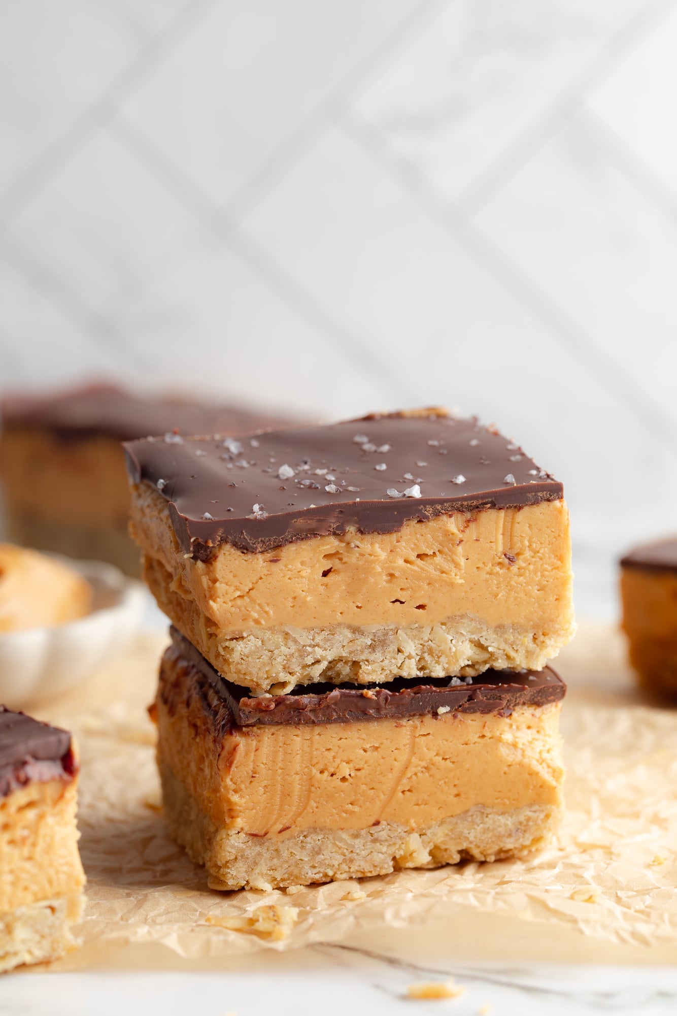 side view of two Chocolate Peanut Butter Oatmeal Bars stacked on top of each other.