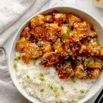 overhead view of sesame cauliflower in a bowl with rice.