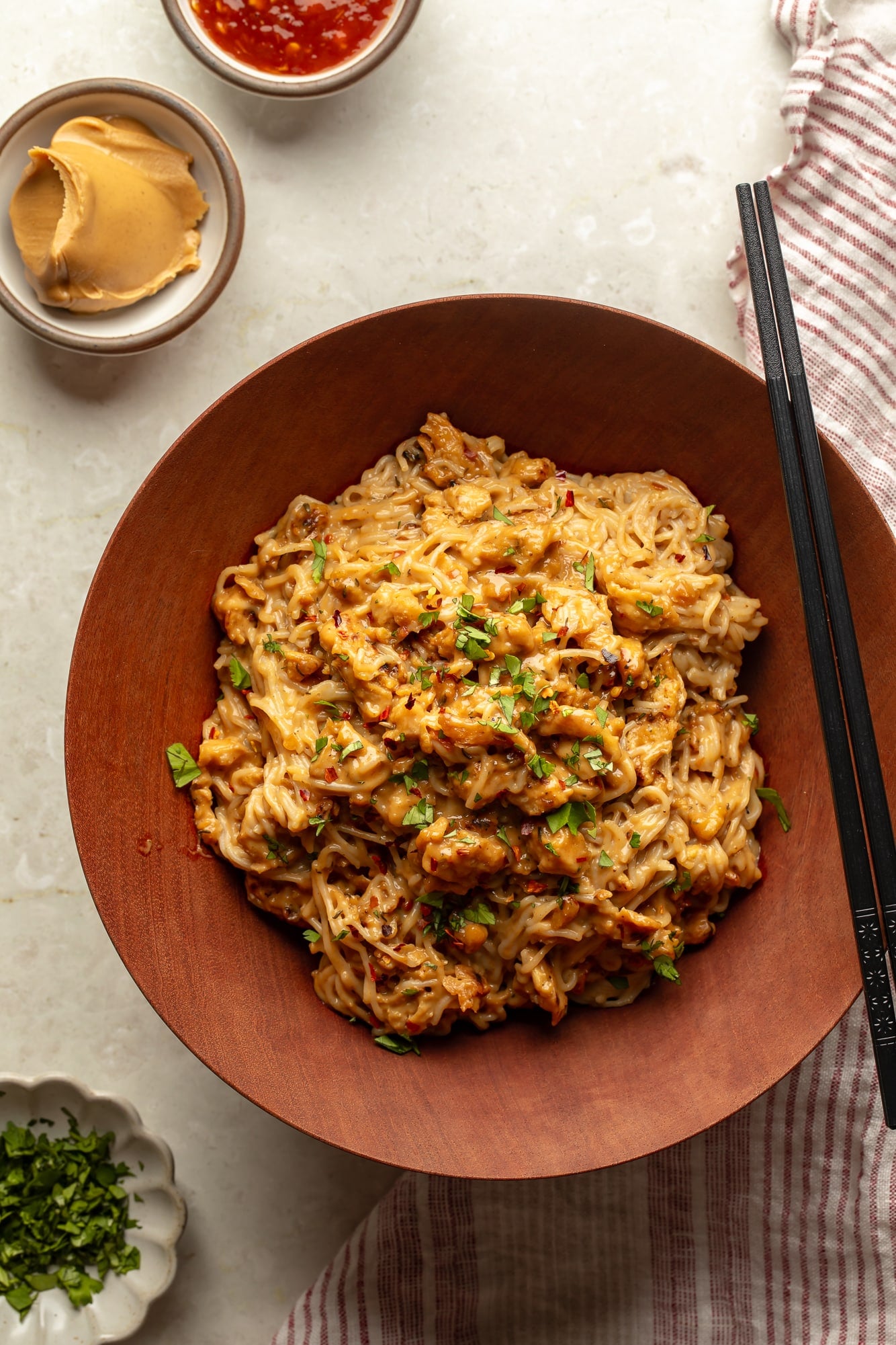 overhead view of spicy peanut vegan "chicken" noodles in a bowl.