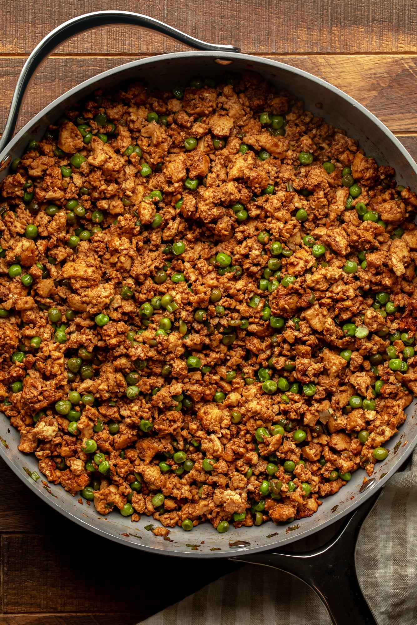 overhead view of spicy ginger ground tofu in a large skillet.