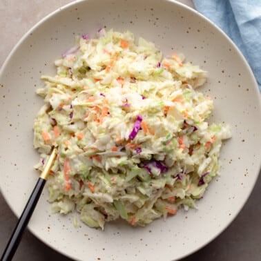 overhead view of a bowl of creamy vegan coleslaw.