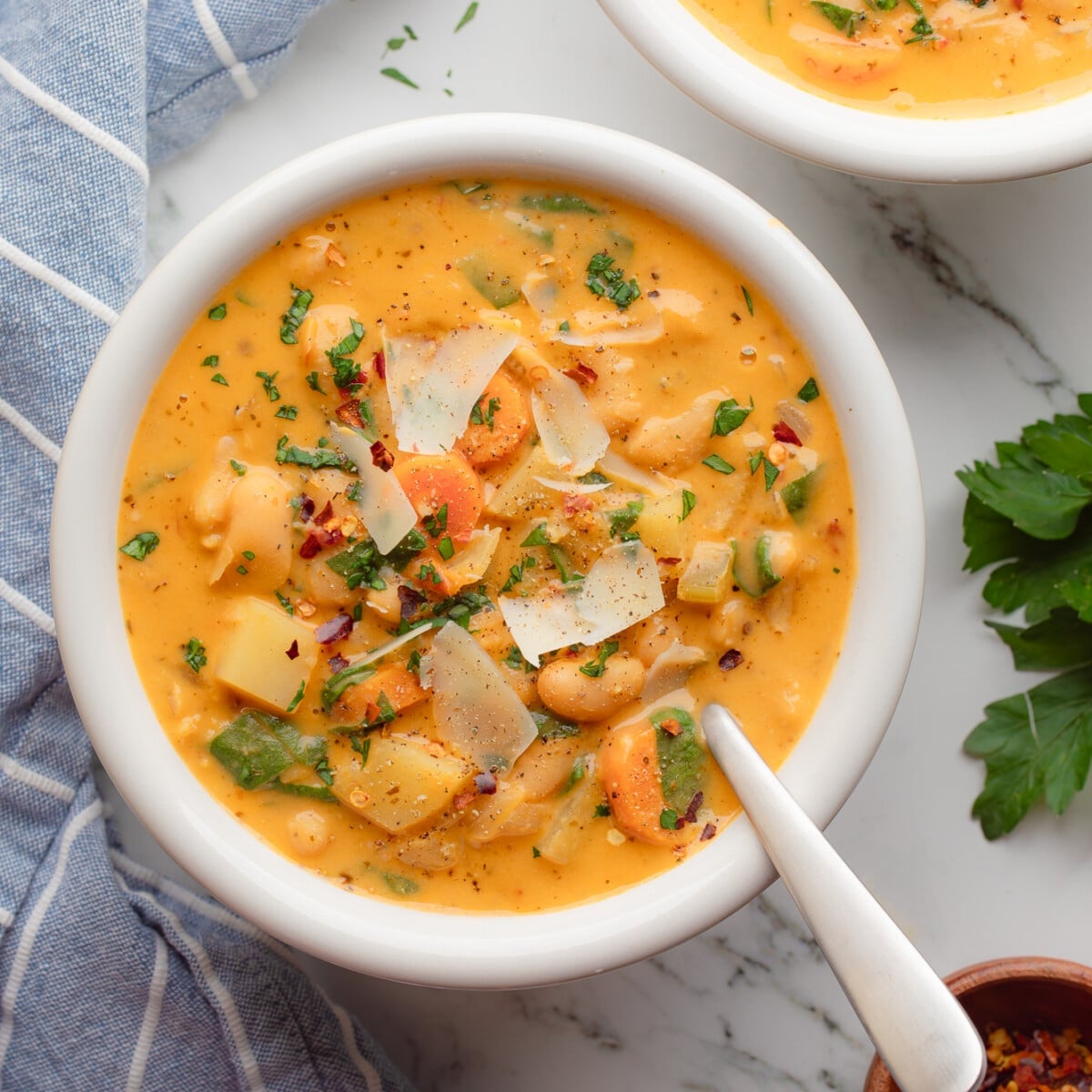 close up on a bowl of Tuscan white bean soup.