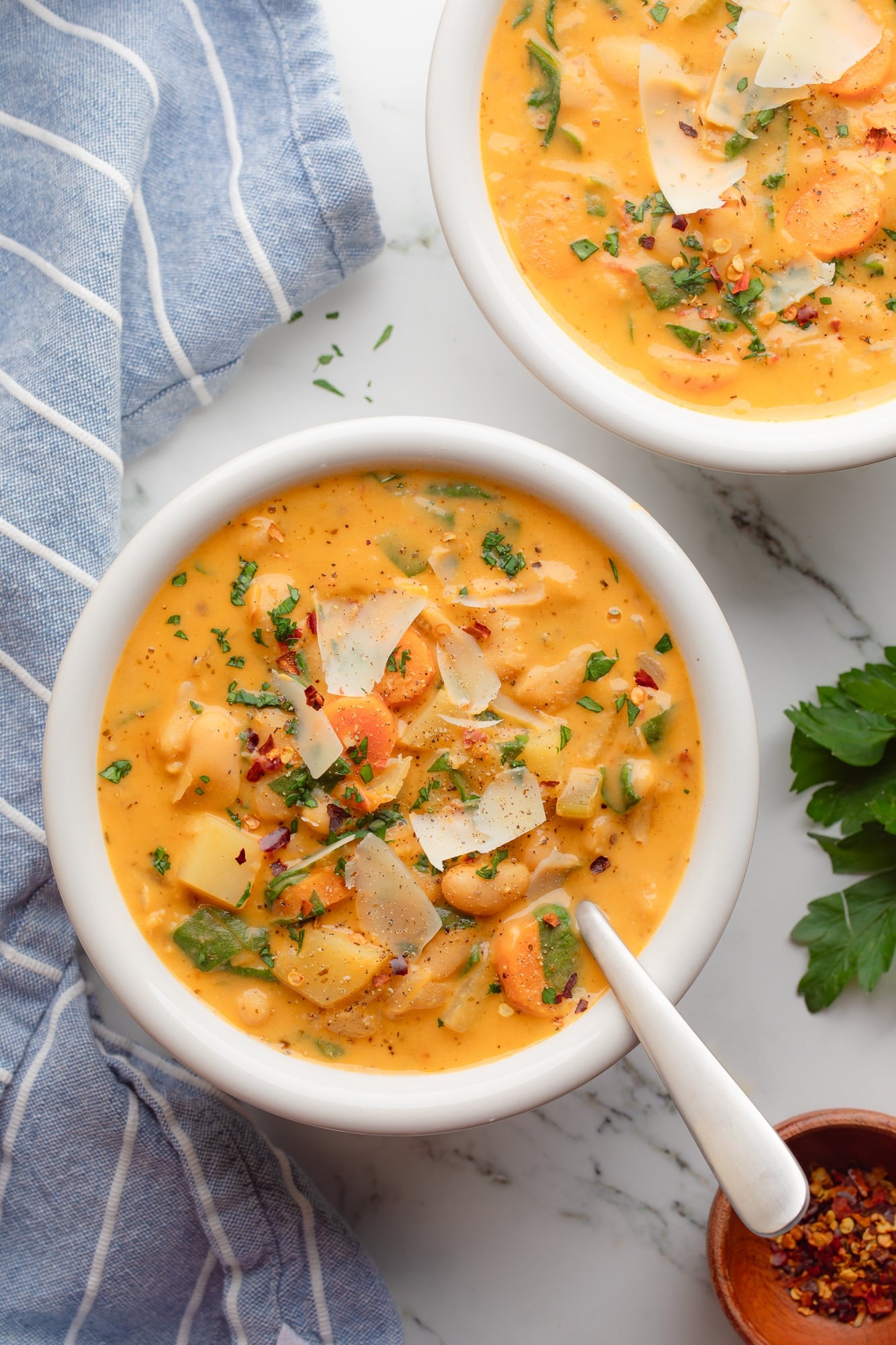 overhead view of 2 bowls ofTuscan white bean soup.